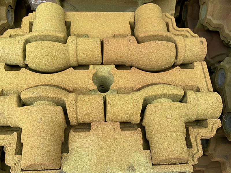 Comment résoudre le défaut de collage de sable dans la production de pièces en fonte grise en utilisant la technologie de sable enduit de film?